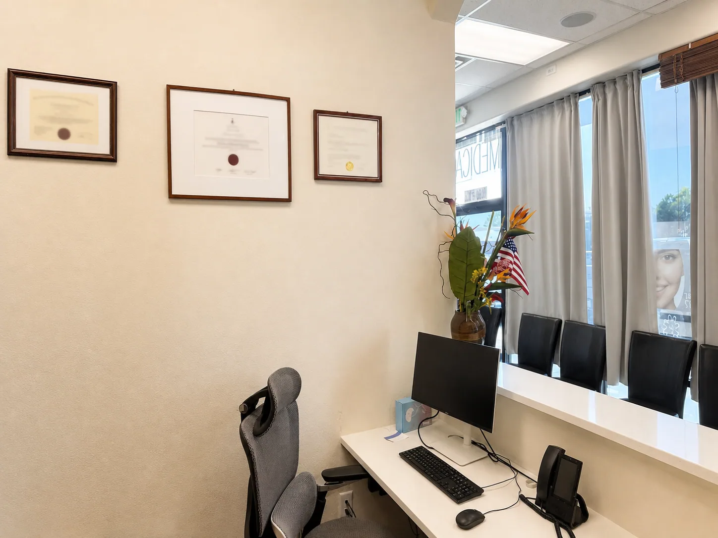 Framed dental credentials beside the consultation area at Star Dental in Denver