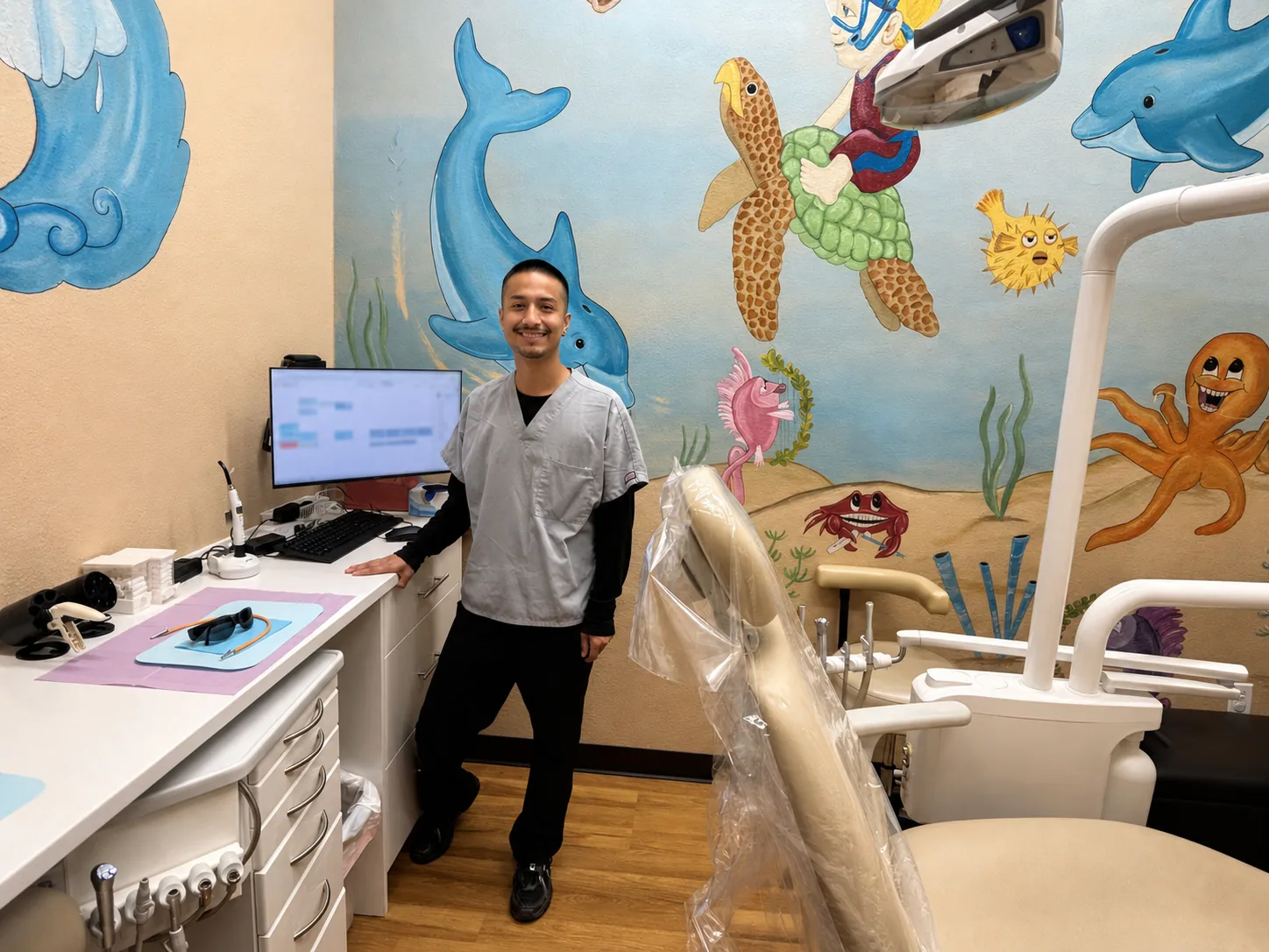 Star Dental team member in the colorful family treatment room at the Denver office
