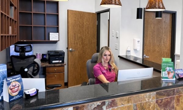 Star Dental reception team helping patients understand Medicaid dental coverage in Denver